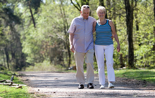 A couple walking on a path together. Links to Closely Held Business Stock stock.jpg